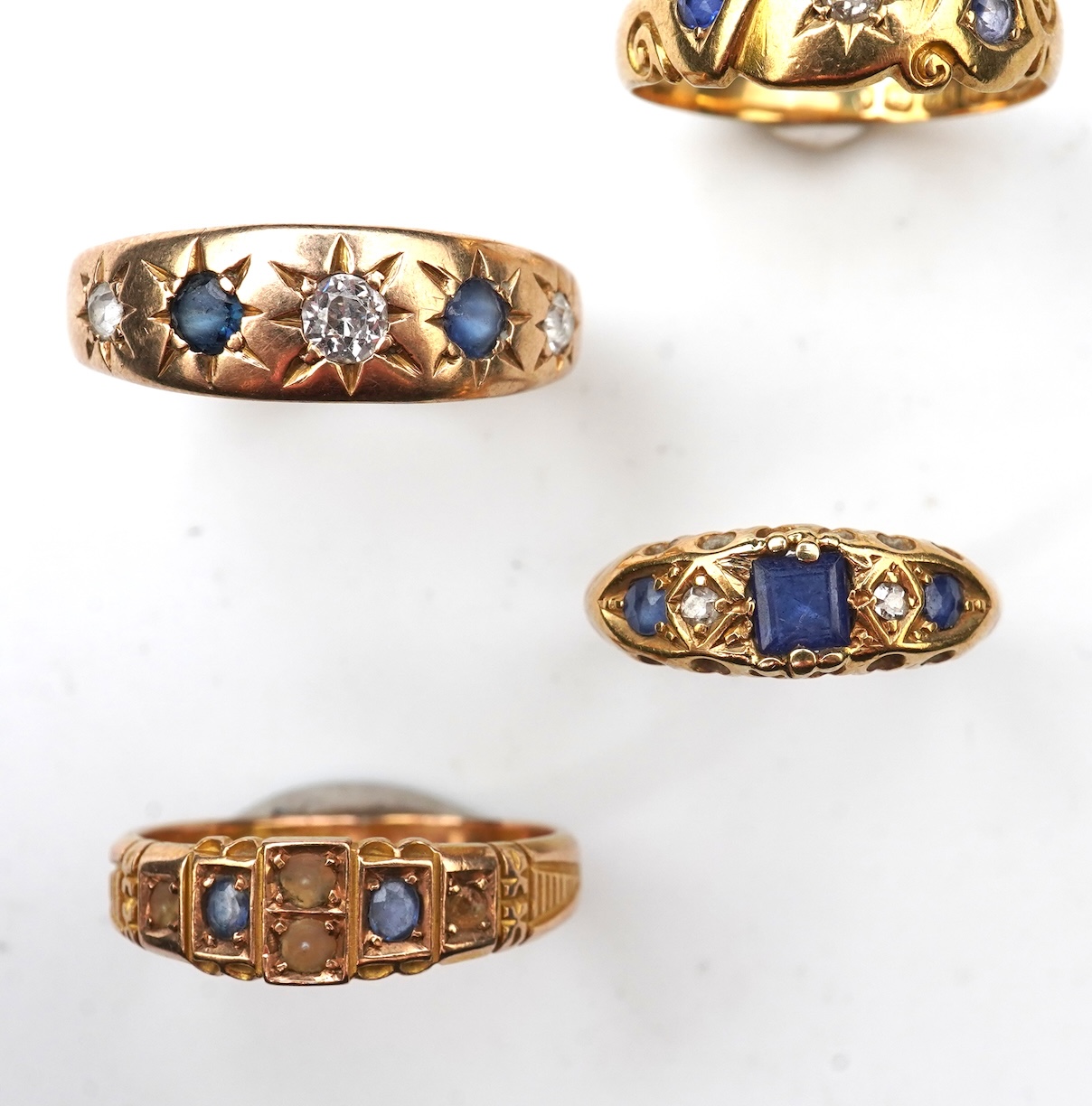 A group of four sapphire rings, late 19th/early 20th century